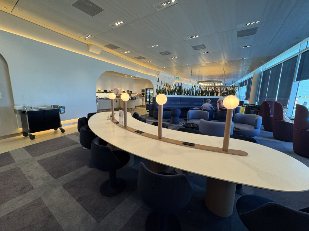 a room with a long table and chairs