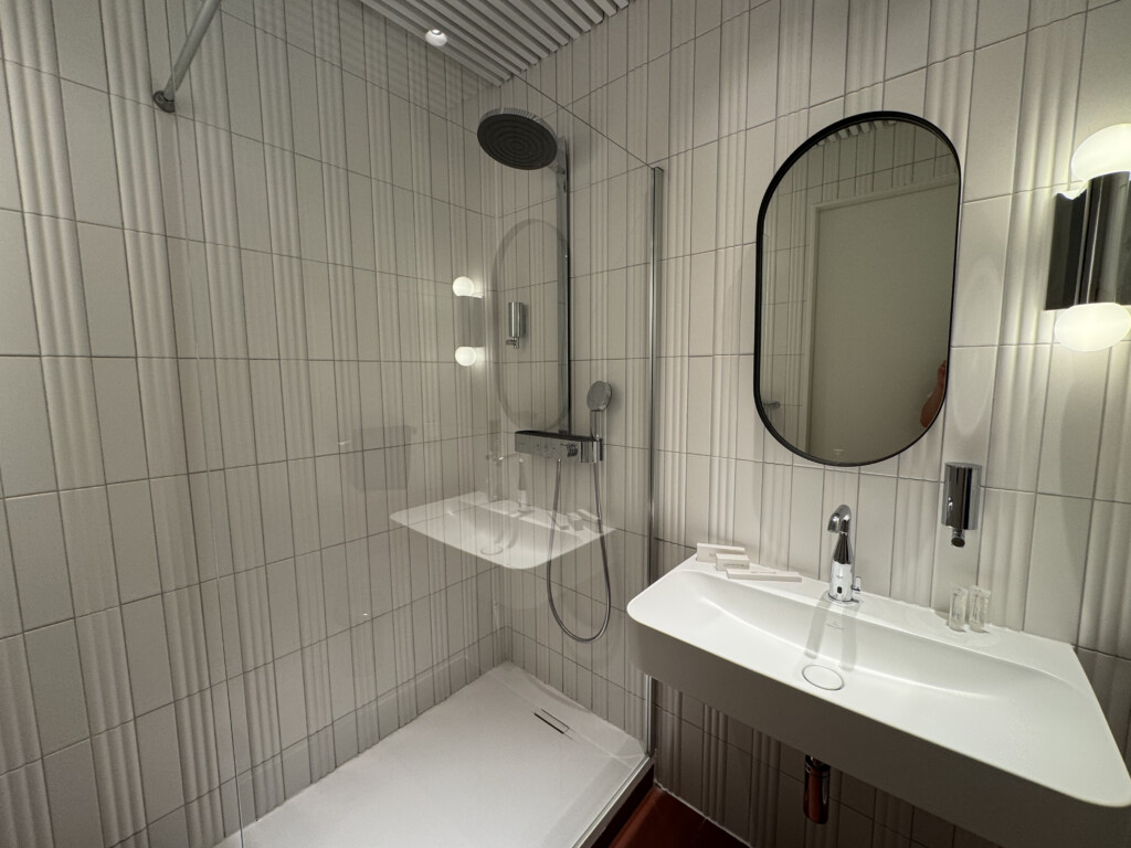 a bathroom with a shower and sink