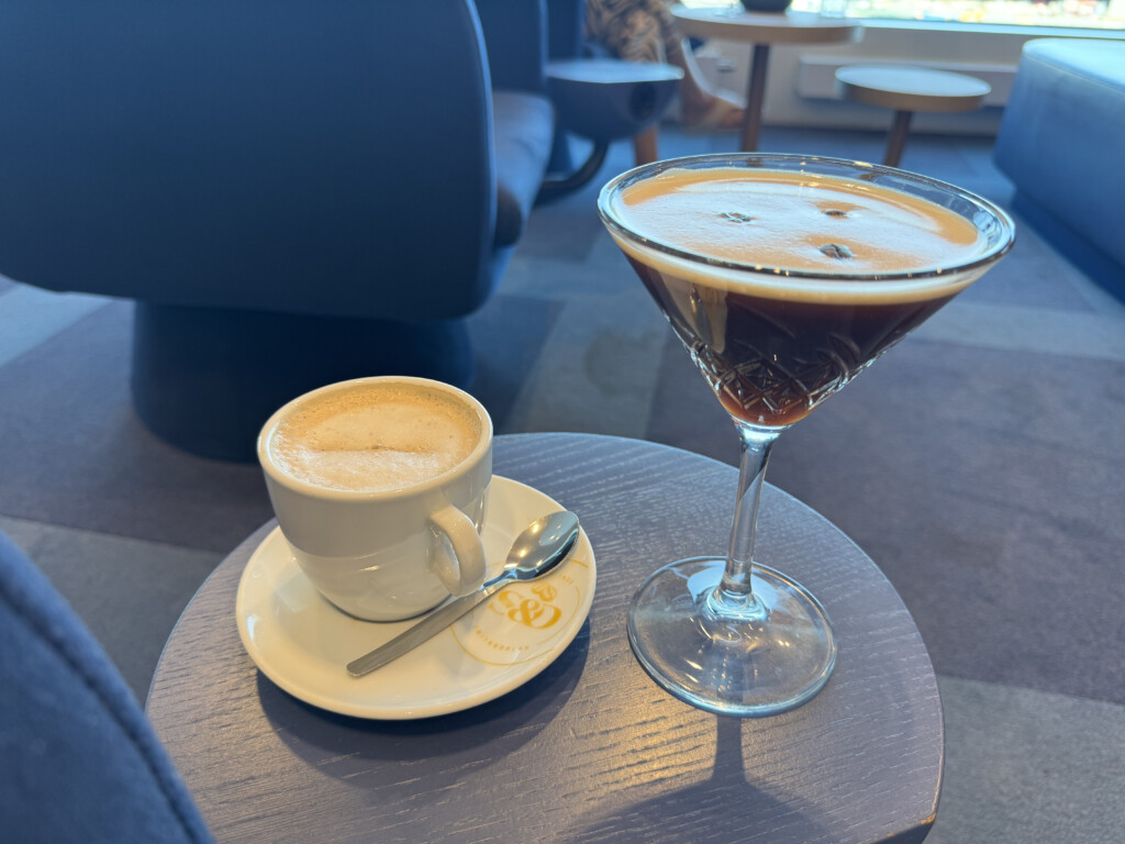 a drink and a cup on a table