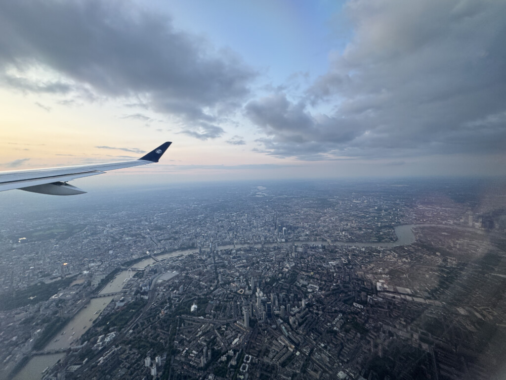 an airplane wing and a city