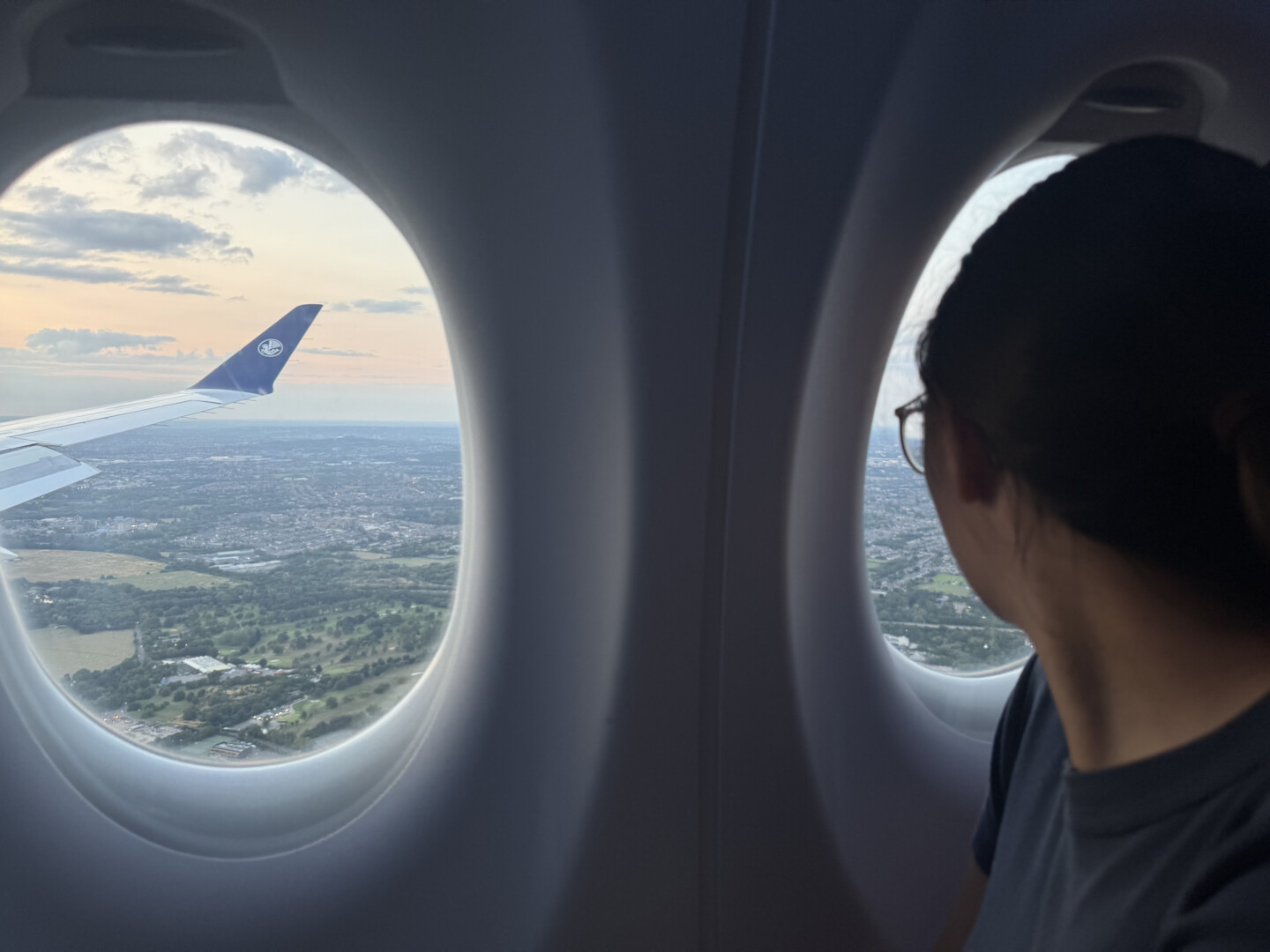 a woman looking out of an airplane window