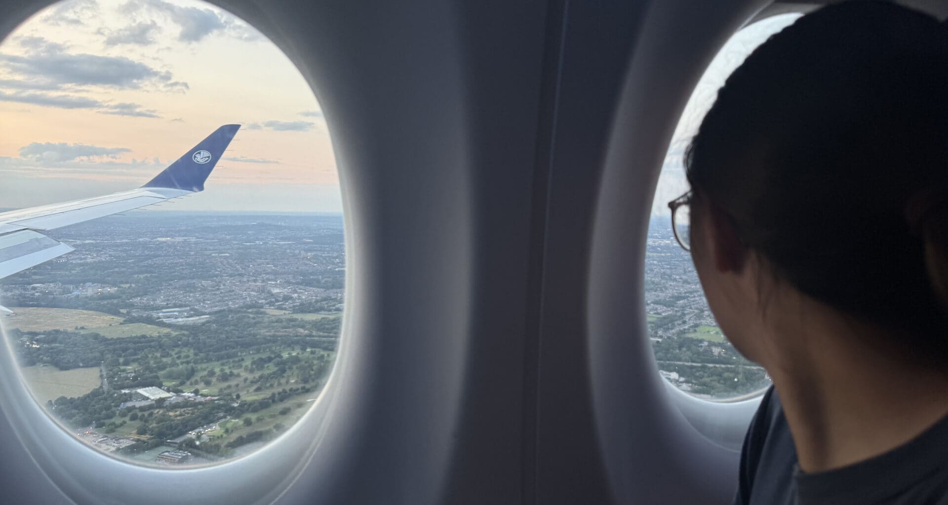 a woman looking out of an airplane window
