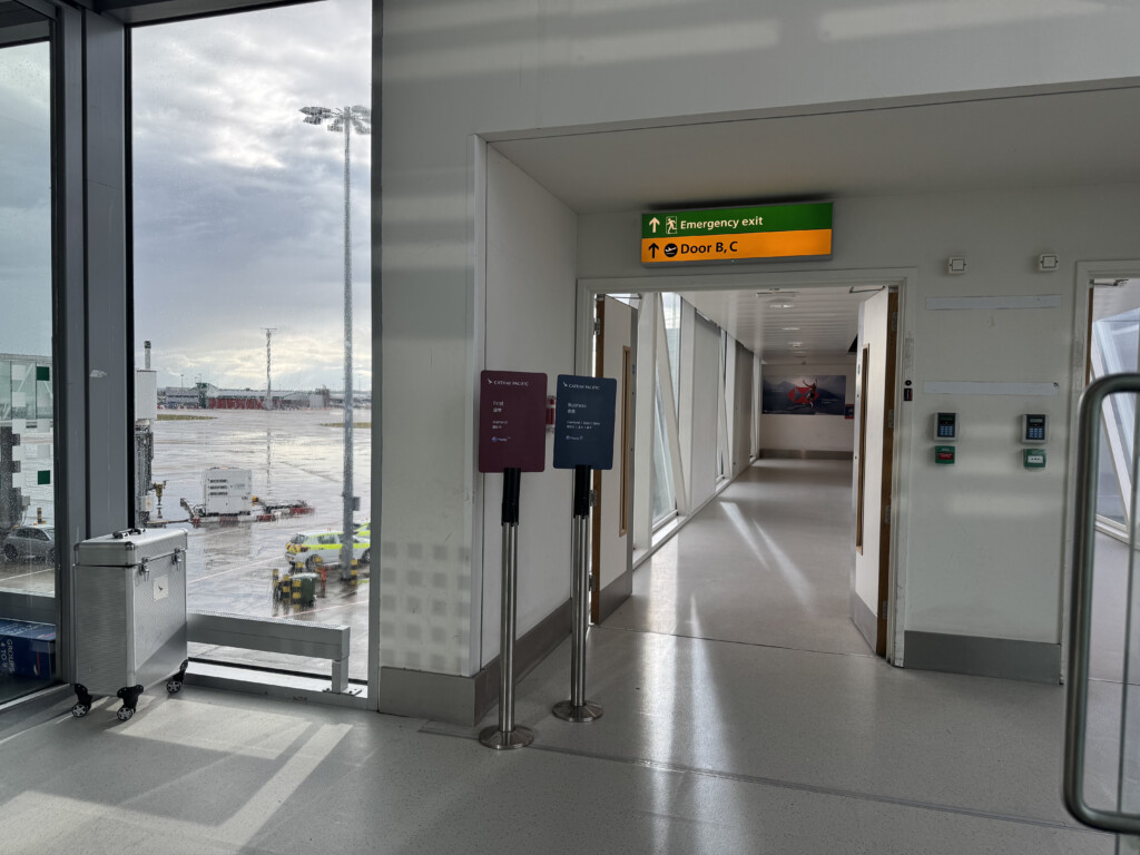 a hallway with a sign and a large window