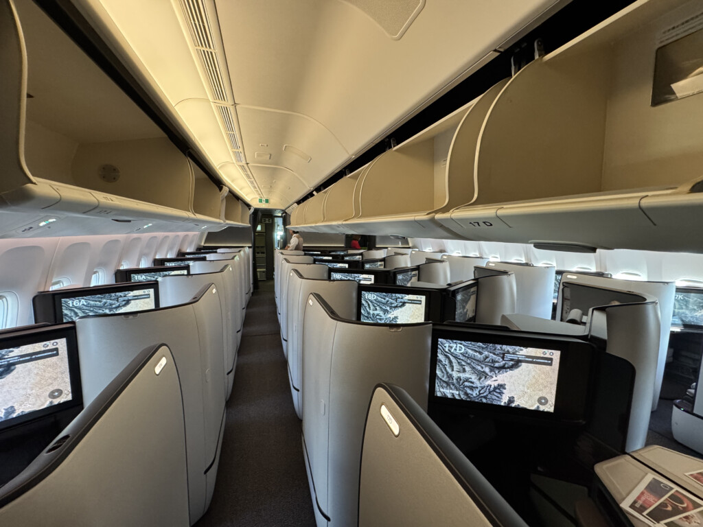 a row of monitors on an airplane