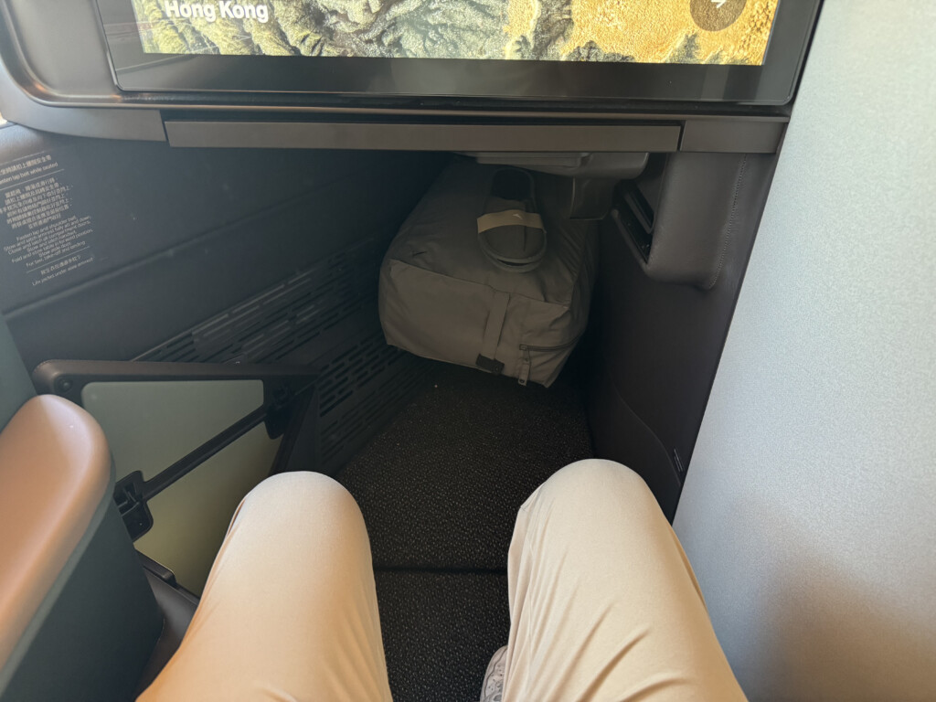 a person's legs in a seat