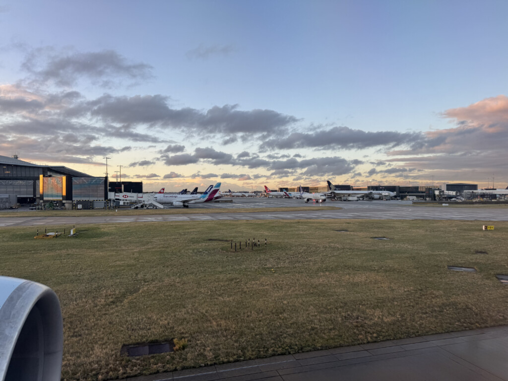 an airport with airplanes on the runway