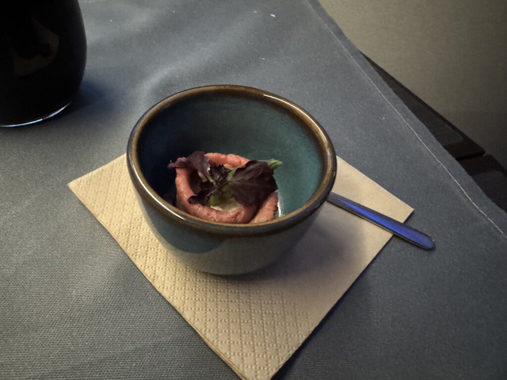 a bowl of food on a napkin