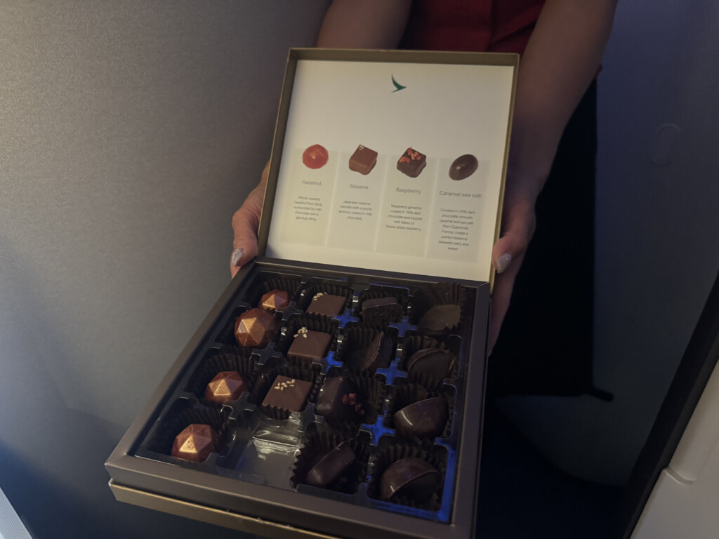 a person holding a box of chocolates