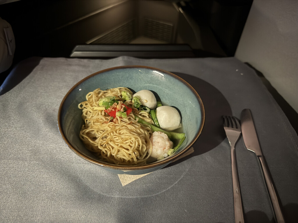 a bowl of noodles and vegetables