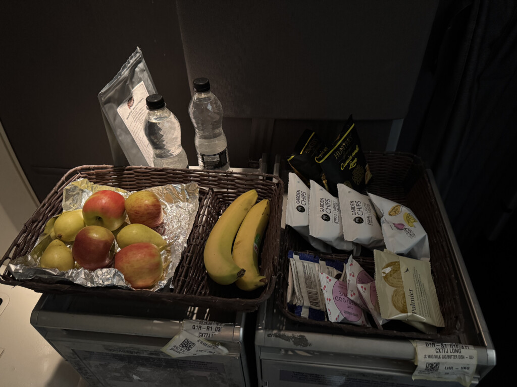 a basket of fruit and a few packages of food