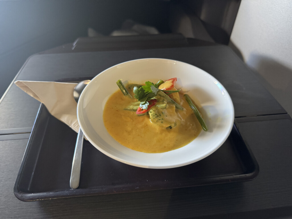 a bowl of soup on a tray