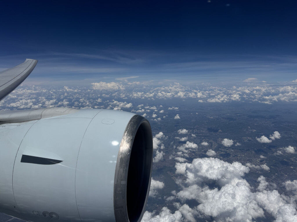 a plane engine and clouds