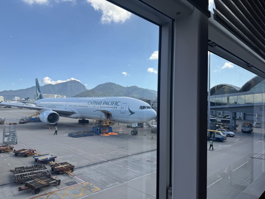 a large white airplane in a terminal