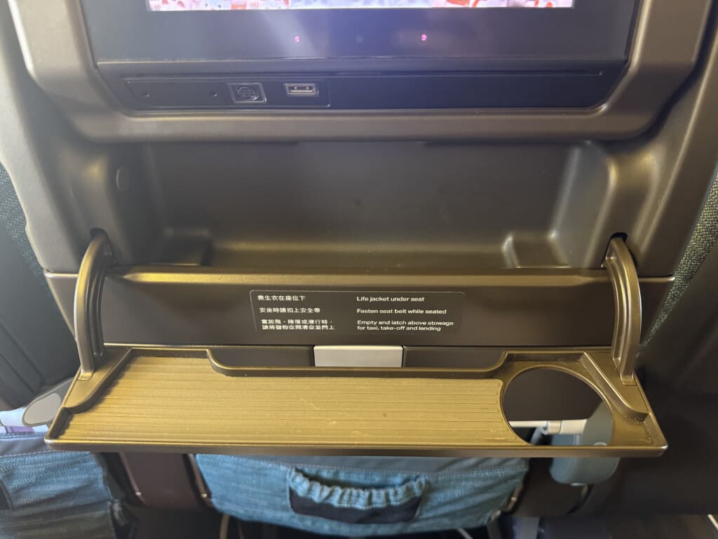 a black shelf with a screen and a pair of blue jeans