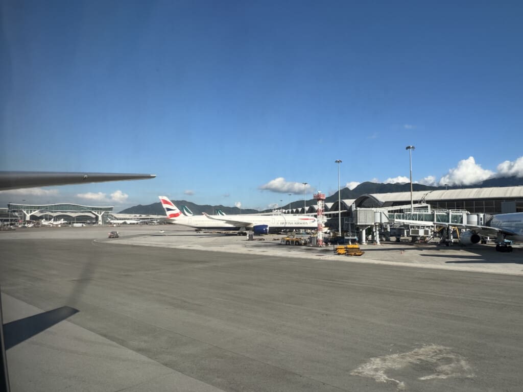 an airport with airplanes and a building