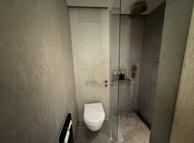 a bathroom with a glass shower door