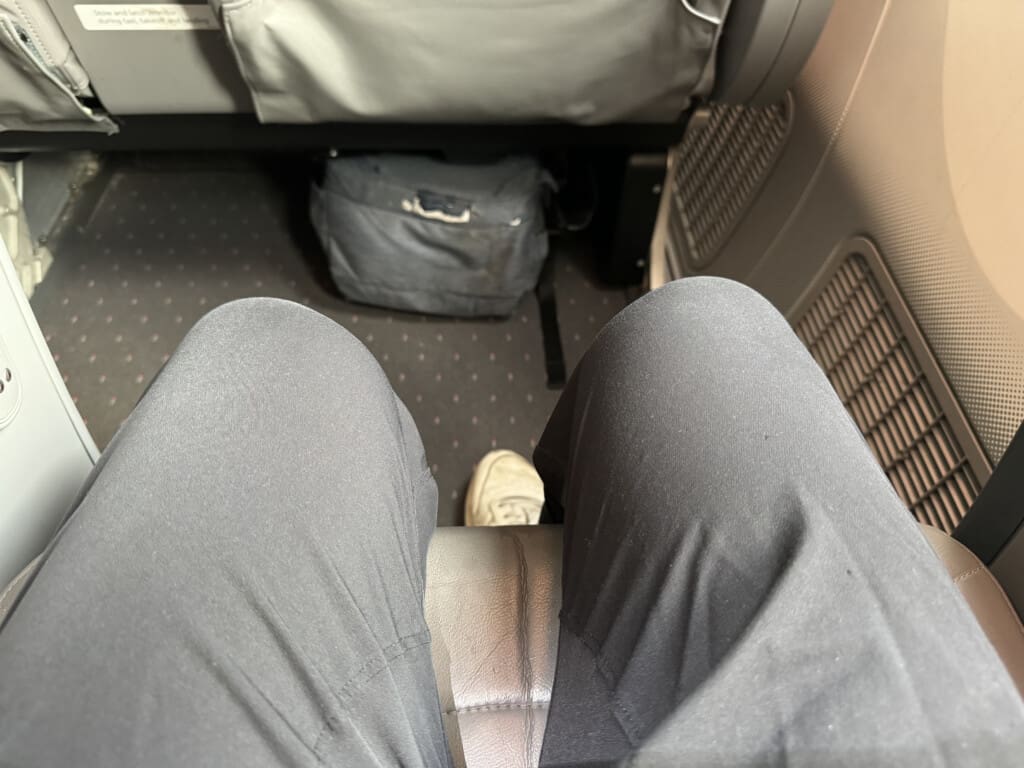 a person's legs in a chair