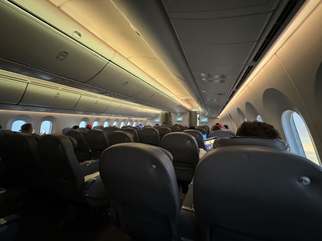 inside an airplane with seats and windows