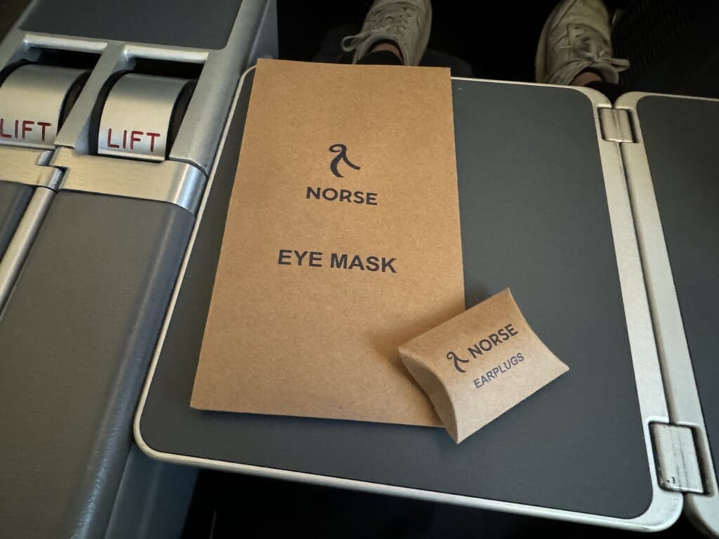a brown paper and a small package on a table