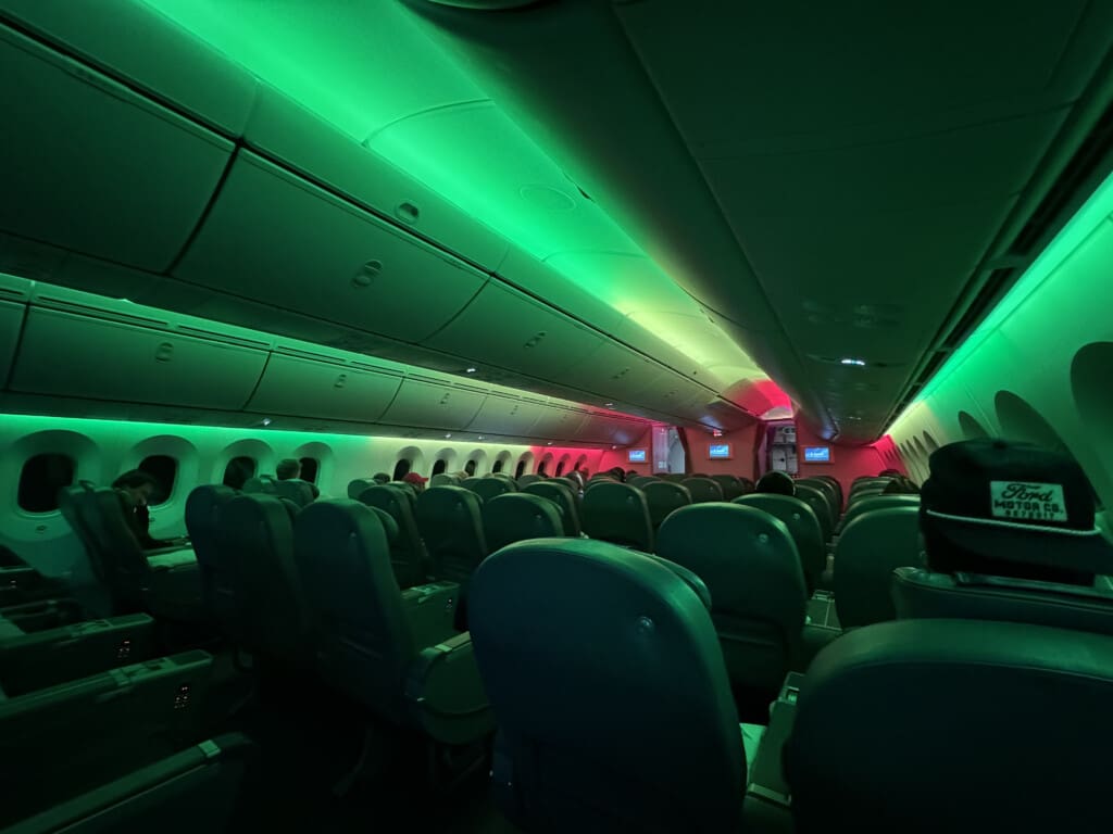 inside an airplane with green lights