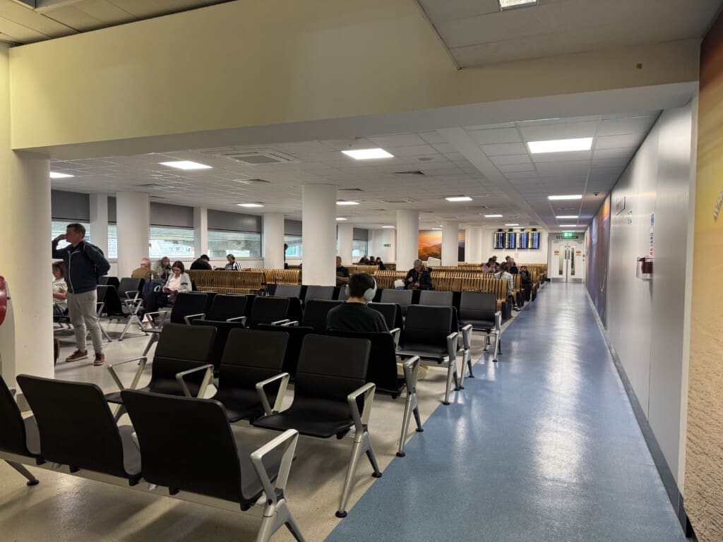 a group of people sitting in chairs in a room