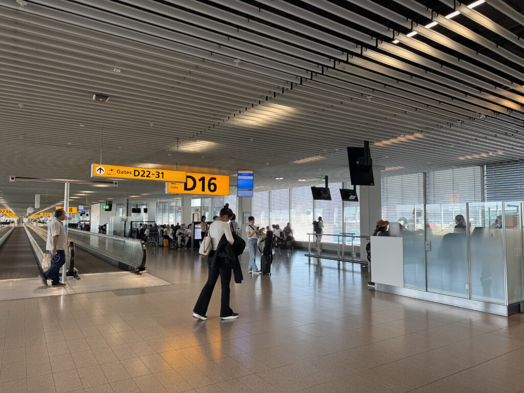 people walking in a large airport