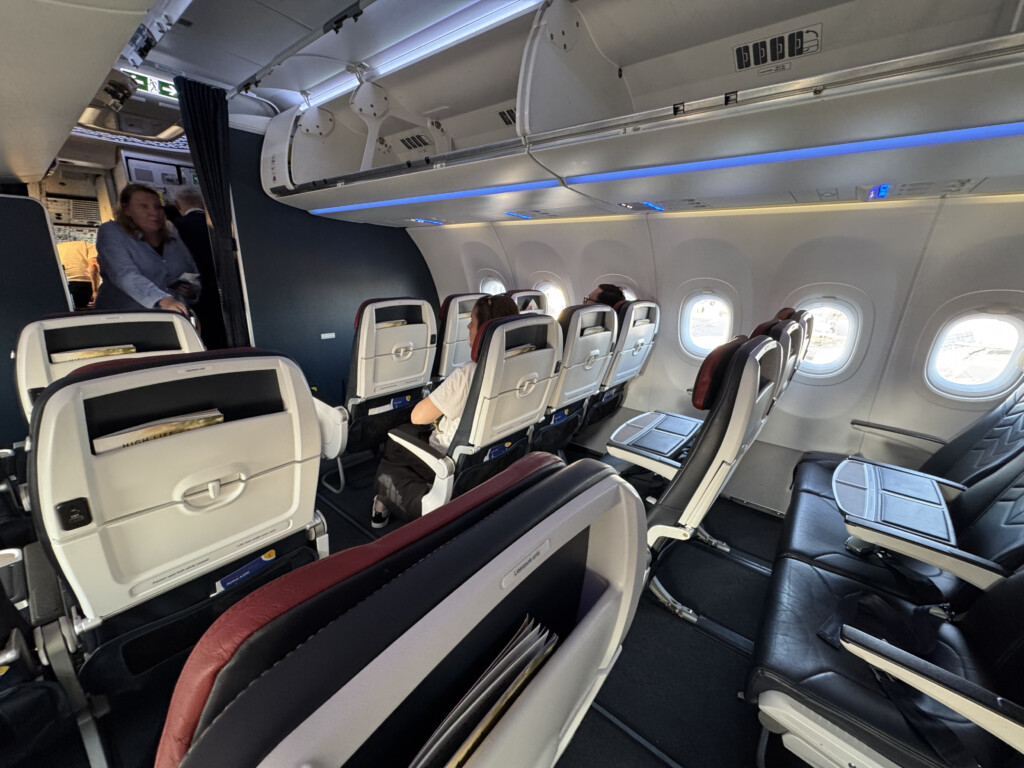 a group of people sitting in an airplane
