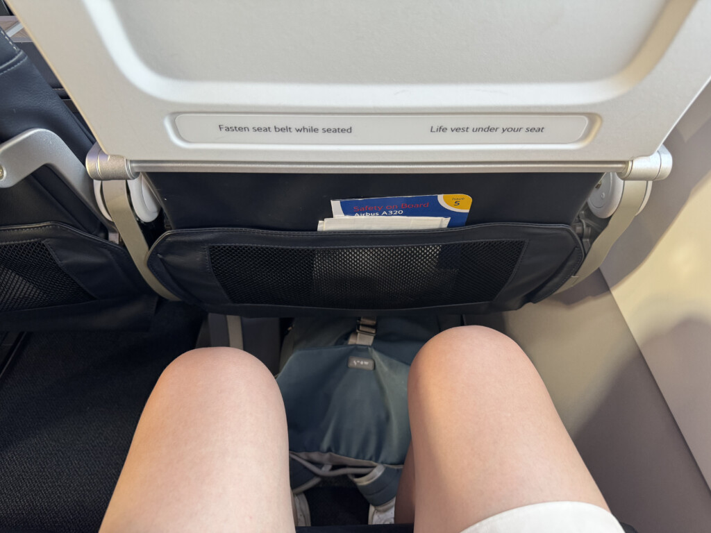 a person's legs in a seat