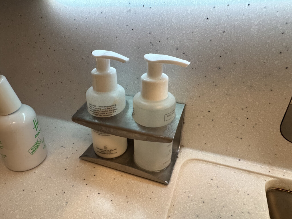 a group of white bottles on a counter
