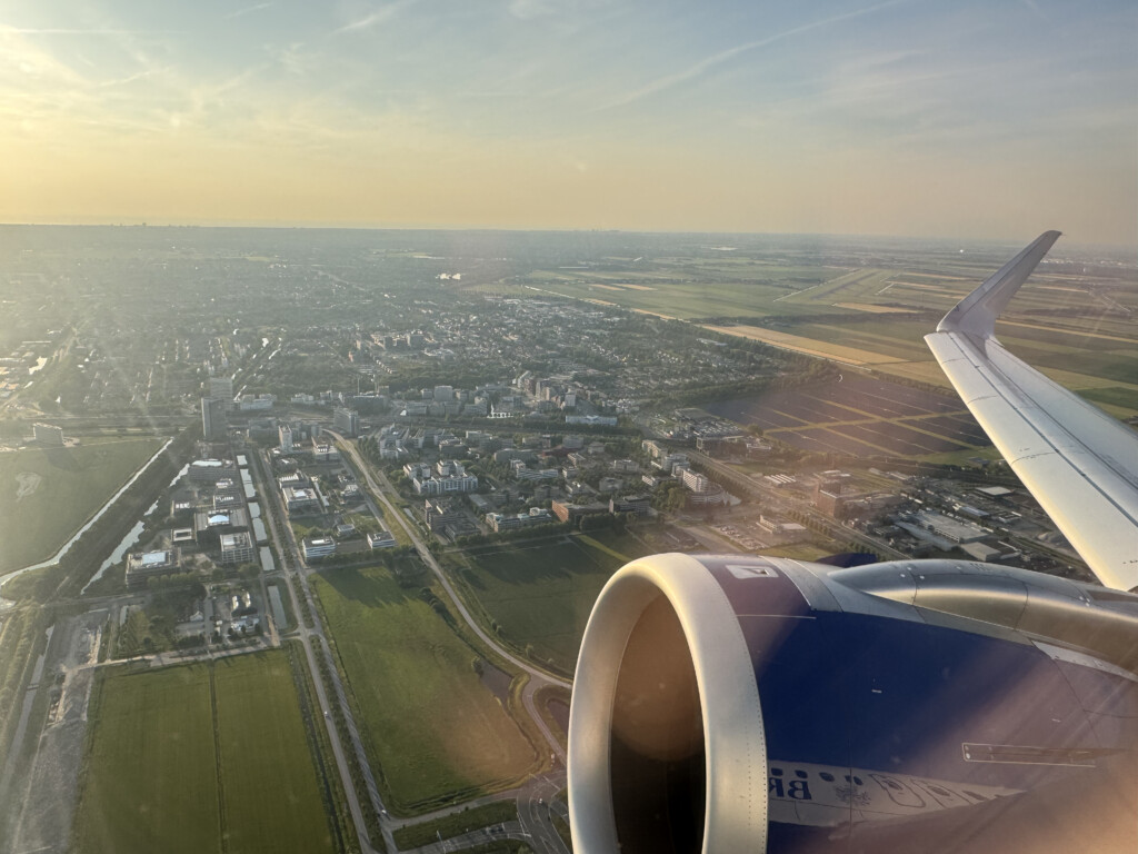 an airplane wing and a city