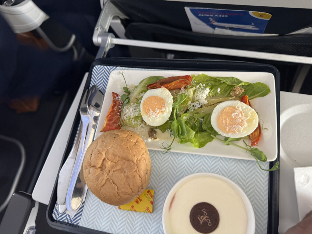 food on a tray with a plate of food