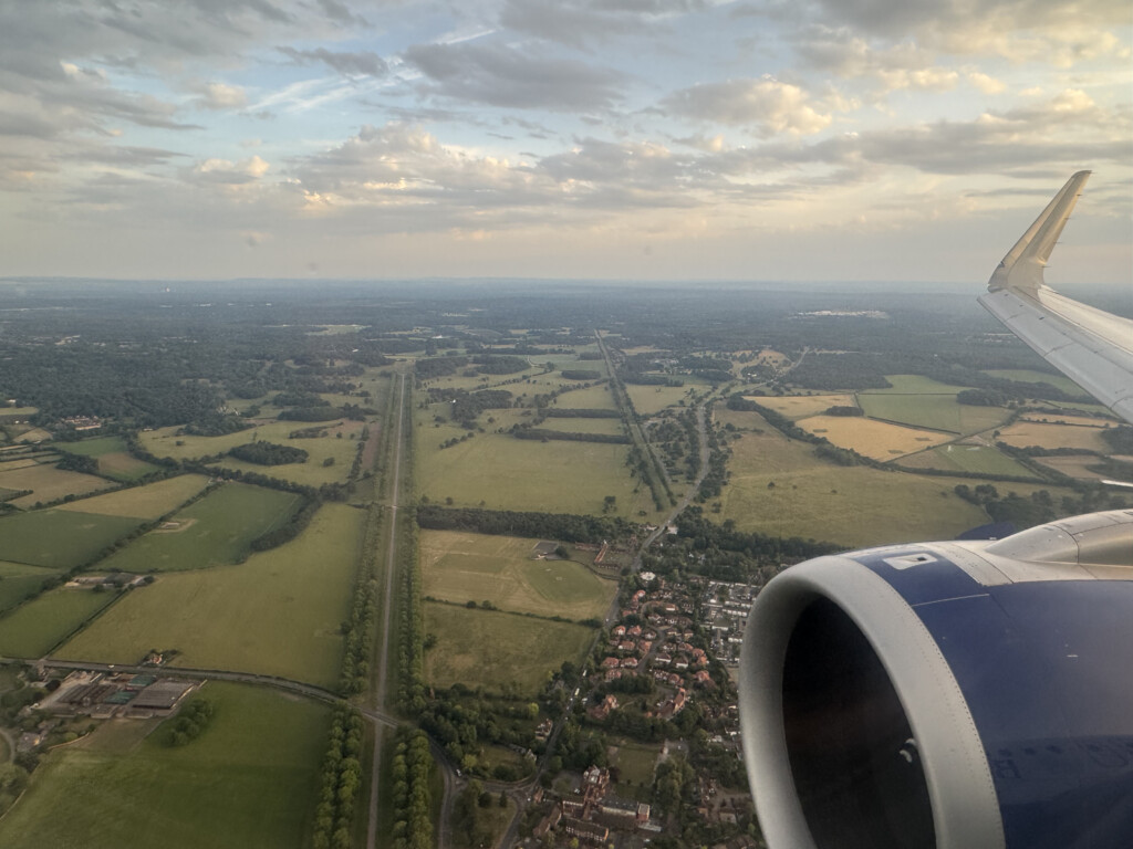 an airplane wing and a landscape