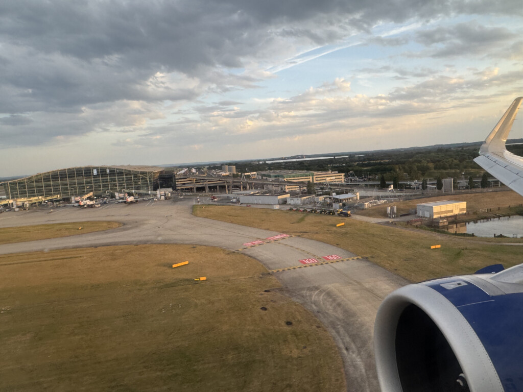 an airplane wing and a runway