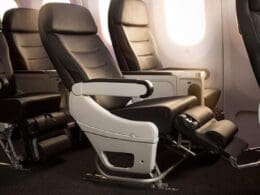 a row of black and white seats in an airplane