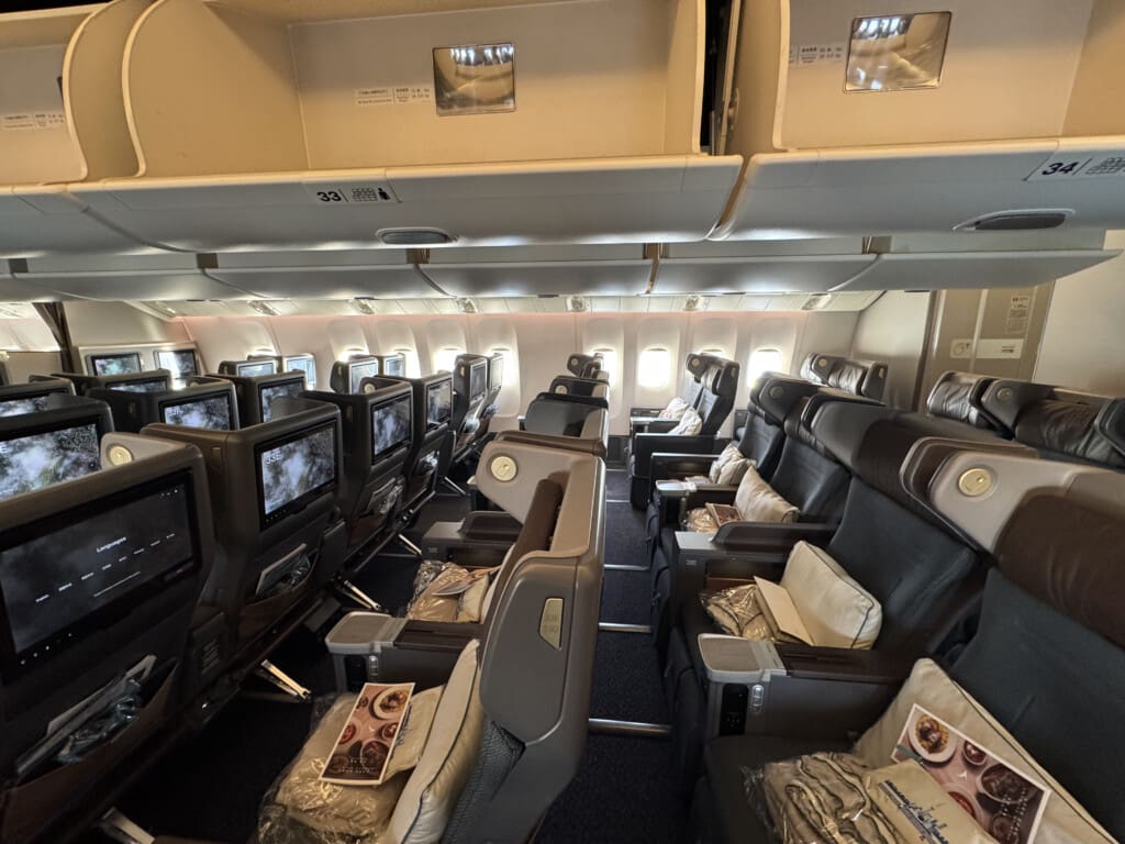 the inside of an airplane with rows of seats