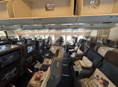 the inside of an airplane with rows of seats