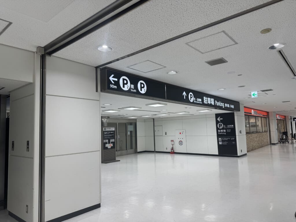 a large white room with signs and doors