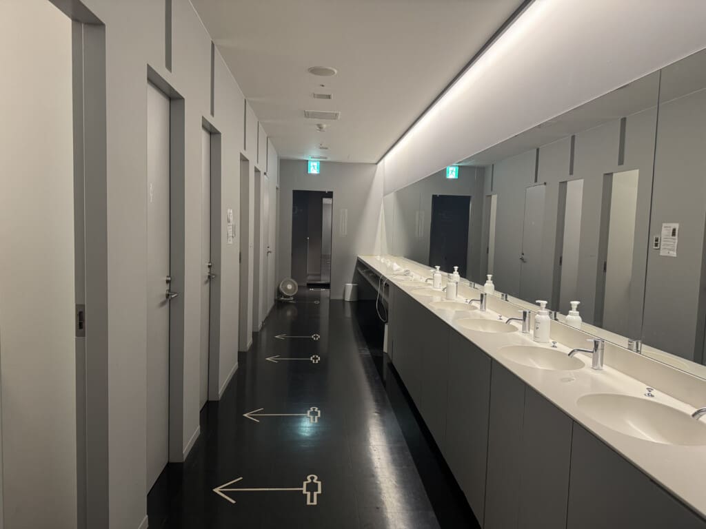 a bathroom with sinks and mirrors