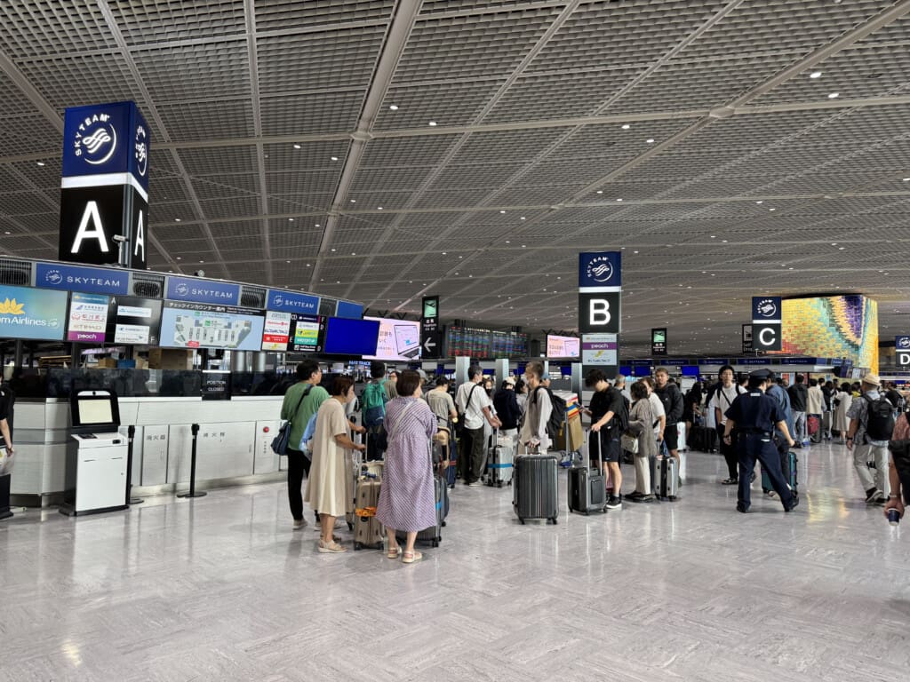 a group of people standing in a terminal