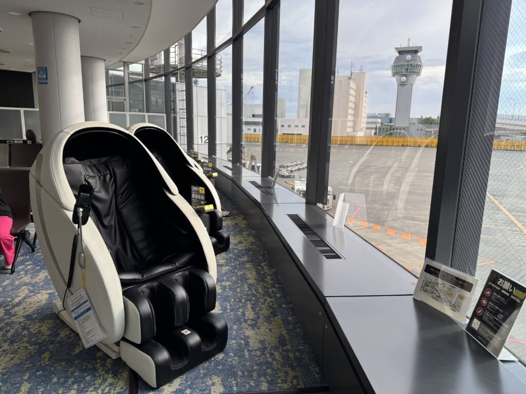 a massage chair in a room with windows