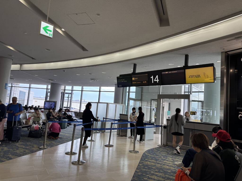 people waiting in a line at an airport