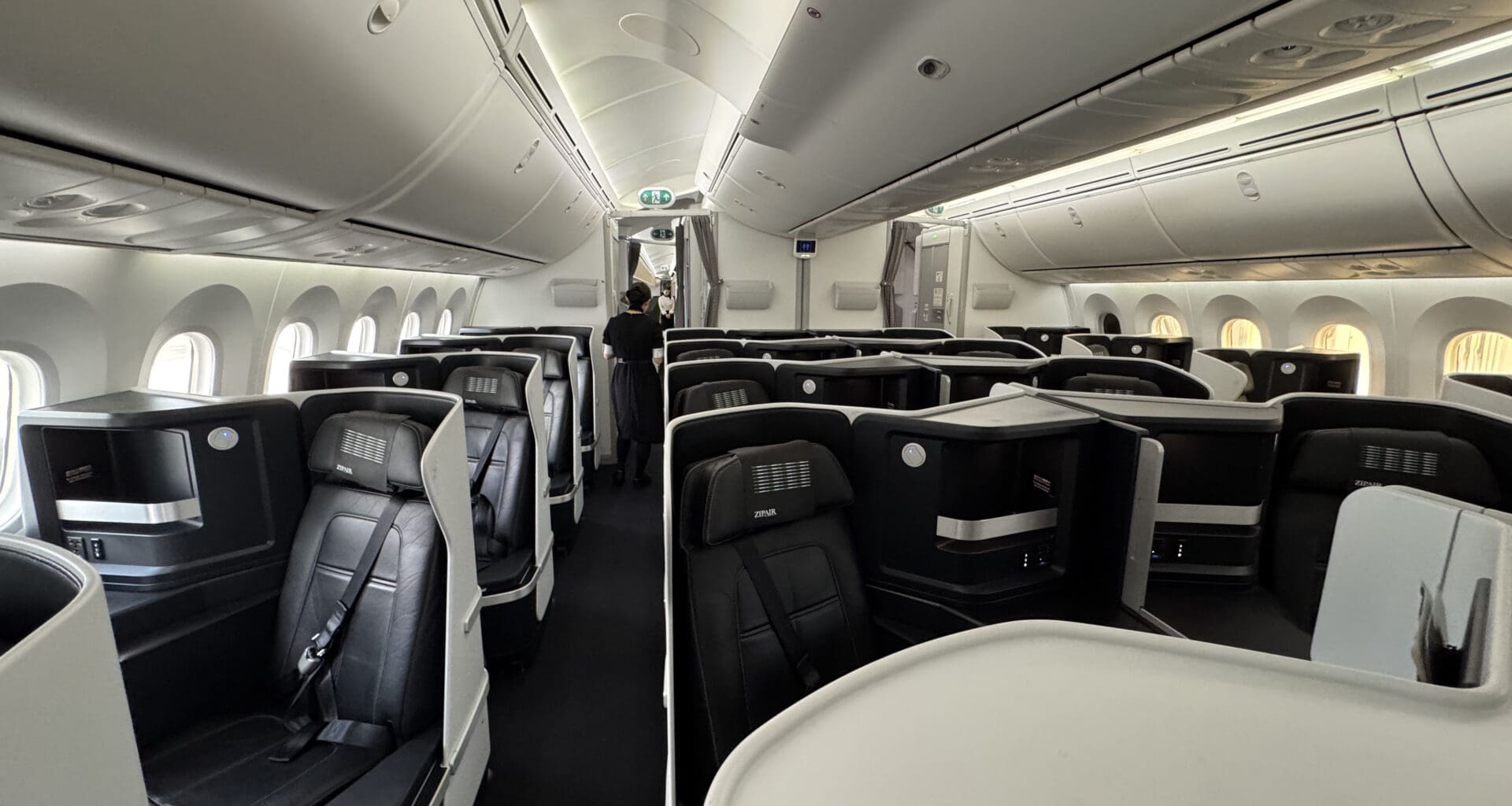 a plane with seats and people in it