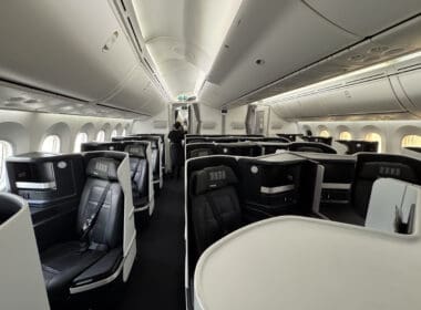a plane with seats and people in it