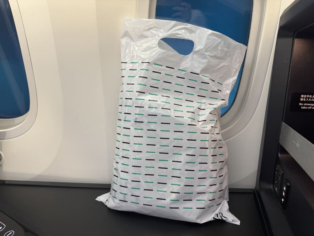 a white plastic bag with black and green lines