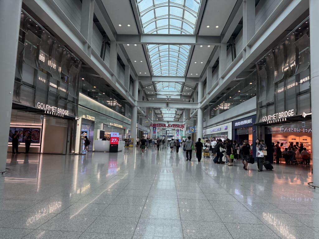 a large building with many people walking in it