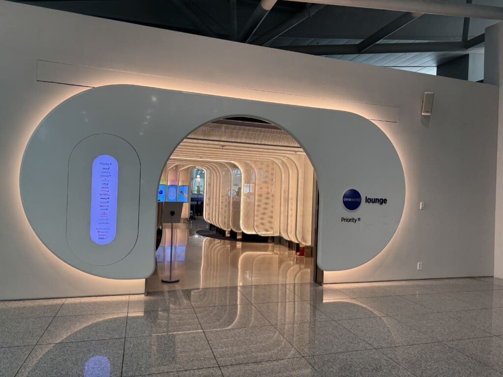 a white wall with a circular doorway