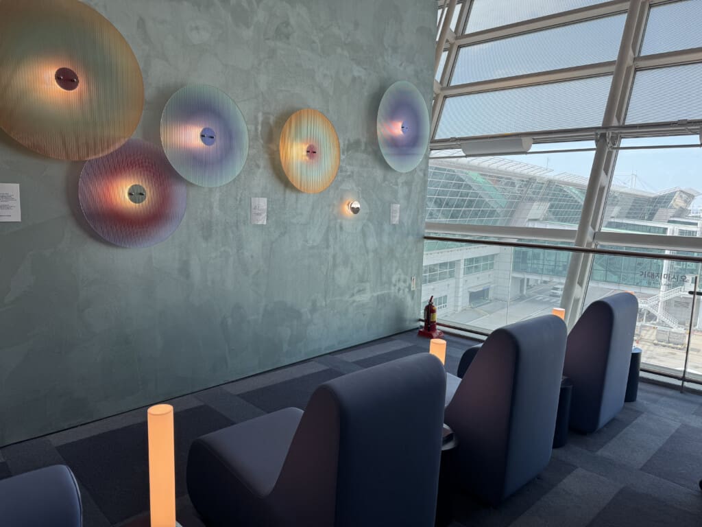 a room with chairs and lights