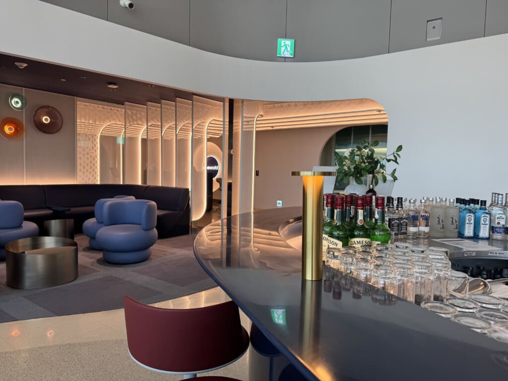 a bar with bottles and glasses on it
