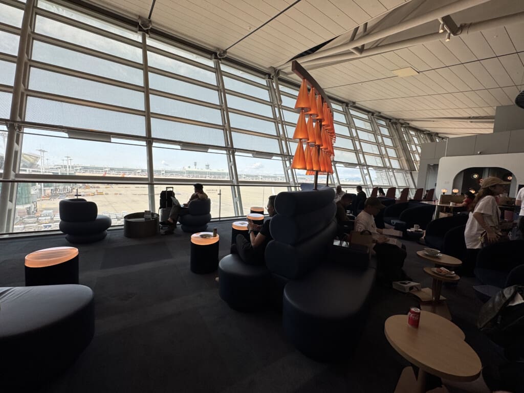 a group of people sitting in a lounge area