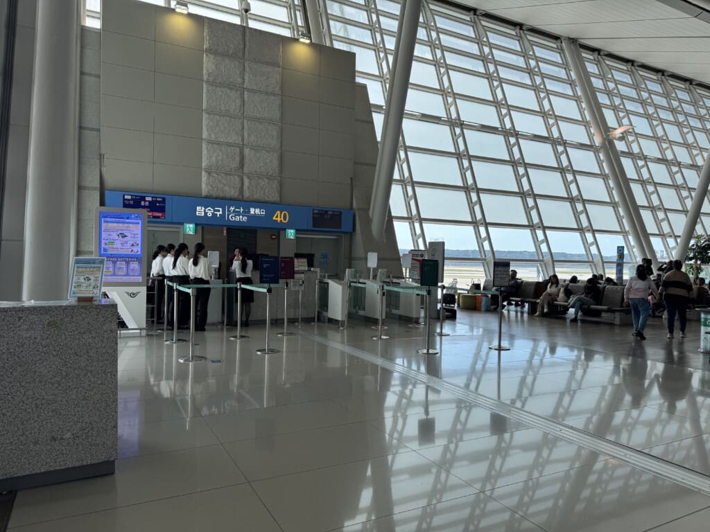 people standing in a line in an airport